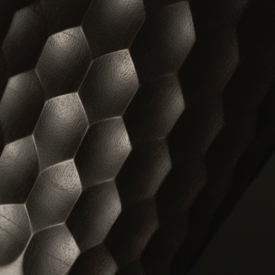 Close-up of a textured black surface with geometric patterns